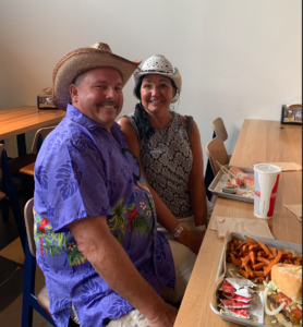 Coule wearing cowboy hats eating in Nashville