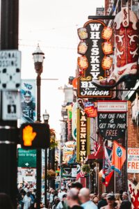 crowded music city nashville street with neon lights