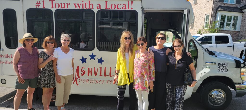 A group of women stands in front of a bus, ready for Nashville tours with local Nashville tour guides.